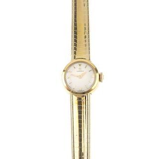 OMEGA - a lady's manual wind watch. The circular-shape cream dial with hourly baton markers, to the