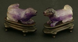 A pair of amethyst crouching Hounds early 20th