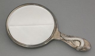 A silver Hand Mirror 20th century the back with a
