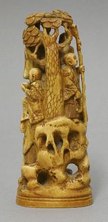 An ivory Okimono c.1870 carved as eight rakan on a