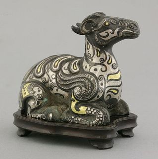 An inlaid bronze mythical beast 20th century cast