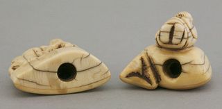 Two ivory Toggles 18th/19th century one a man leaning