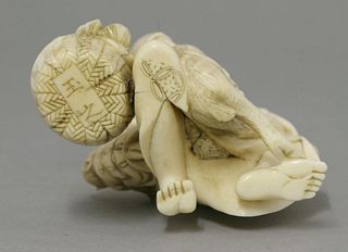 A Japanese ivory Fruiterer c.1880 kneeling holding a