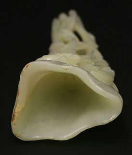 A white jade 'rhinoceros horn' Lotus Cup early 20th