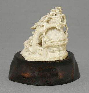 An ivory Group c.1880 of a thatched wellhead