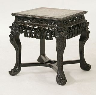A carved blackwood Vase Stand c.1880 with shaped