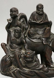 An unusual wood Group of three Buddhist Immortals