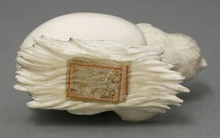 An amusing ivory Chick late 19th century emerging