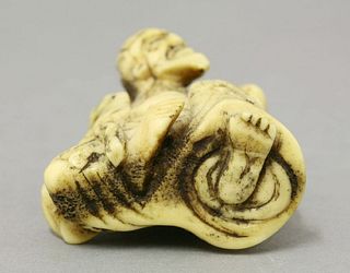An unusual Chinese stag antler carving of Liu Hai