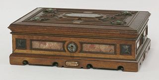 A Victorian oak casket, the panelled lid with crisply