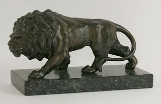 A bronze lion, on a marble plinth, 32cm