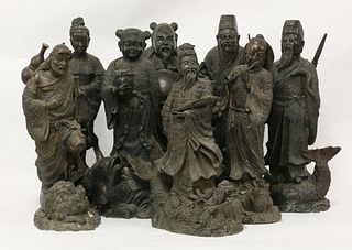 A set of eight bronze Daoist immortals,each standing on