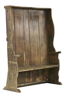 A pine settle, mid 18th century, the concave back with
