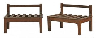 A pair of oak luggage rests, with raised backs and