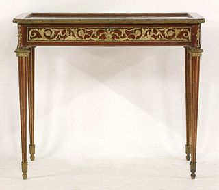 A Louis XVI style walnut and gilt bronze mounted