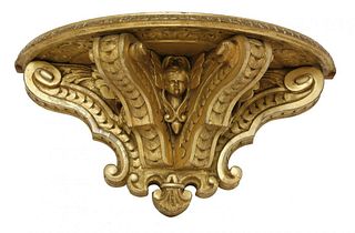 A giltwood wall bracket, 19th century, with a demilune