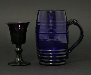 A blue glass Mug, c.1820, possibly Bristol, the