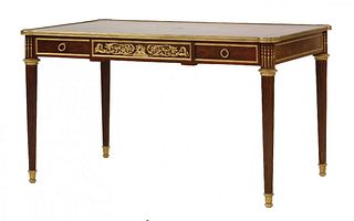 A Louis XVI style mahogany and gilt bronze mounted