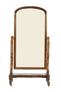A Victorian mahogany cheval mirror, the arched mirror