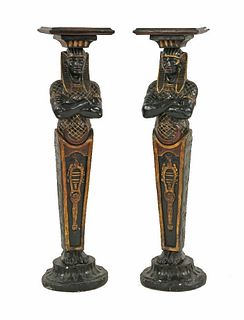 A pair of painted and parcel gilt plaster pedestals,