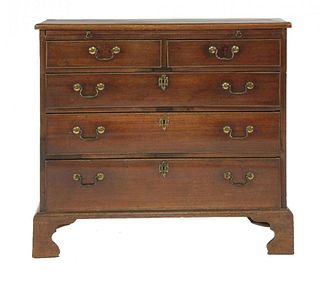 A George III mahogany chest of drawers, with brushing