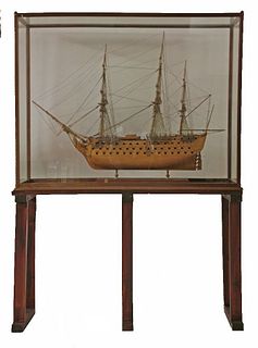 A model of HMS Victory, in a glazed mahogany case, on