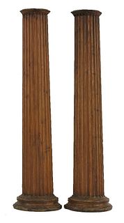 A pair of stripped pine pilasters, fluted and of half
