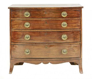 A Regency mahogany and line inlaid bow front chest, of