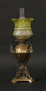 A Victorian brass oil lamp, the triform base with a