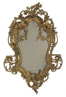 A giltwood and composition wall mirror, in the rococo