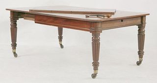 A Regency mahogany dining table, with two extra leaves,