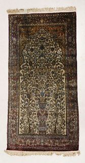 A silk Kashan carpet, the border in purple and blue,