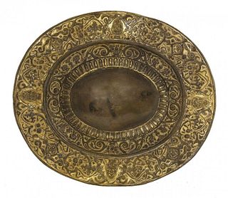 An oval brass and gilt tray, probably Venetian,