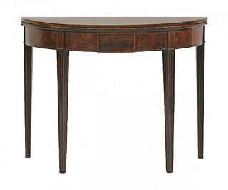 A George III mahogany demilune games table, the