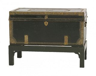 A George III leather covered trunk, with brass edges