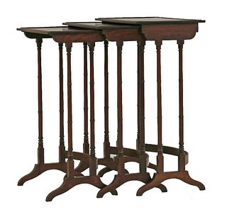 A George III nest of three mahogany tables, with plain