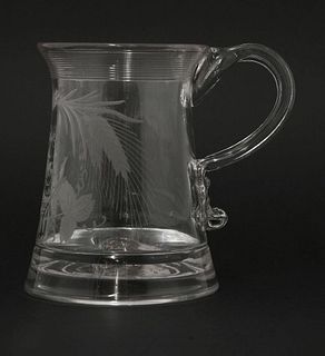 A glass Tankard, c.1800, having a ribbed everted neck