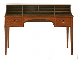 A mahogany desk, the raised back with eleven
