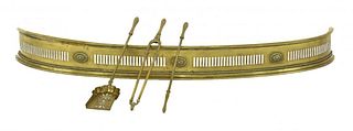 A neoclassical curved brass fender, 18th/19th century,