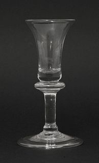 A baluster Gin Glass, 1730-1740, having a bell-shaped