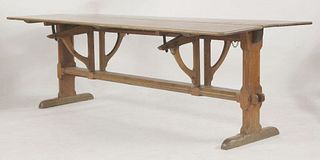 An unusual Arts and Crafts centre table, the drop-leaf