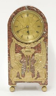 A rouge marble mantel clock, late 19th century, of