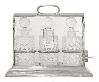 A silver-plated tantalus,by Walker & Hall, 'The Only'