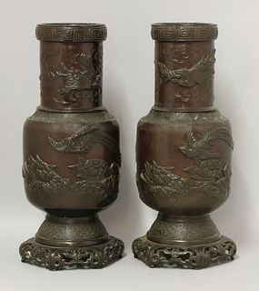 A pair of bronze Vases, c.1900, each drum base cast