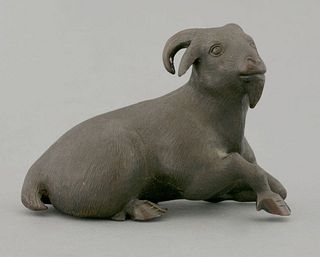 A bronze Goat,c.1880, the beast recumbent and with