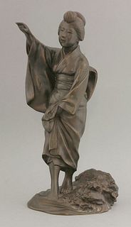 A bronze Fishergirl, c.1890, standing in the water