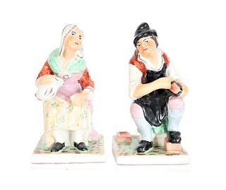 Pair of Seated Porcelain Figures, Man and Woman