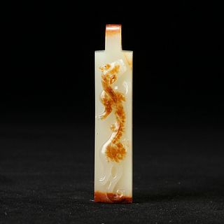 A WHITE AND RUSSET JADE PENDANT