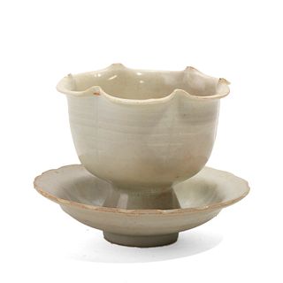 A WHITE-GLAZED FLOWER-FORMED CUP