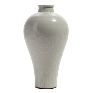 A WHITE-GLAZED CARVED 'DRAGON' MEIPING